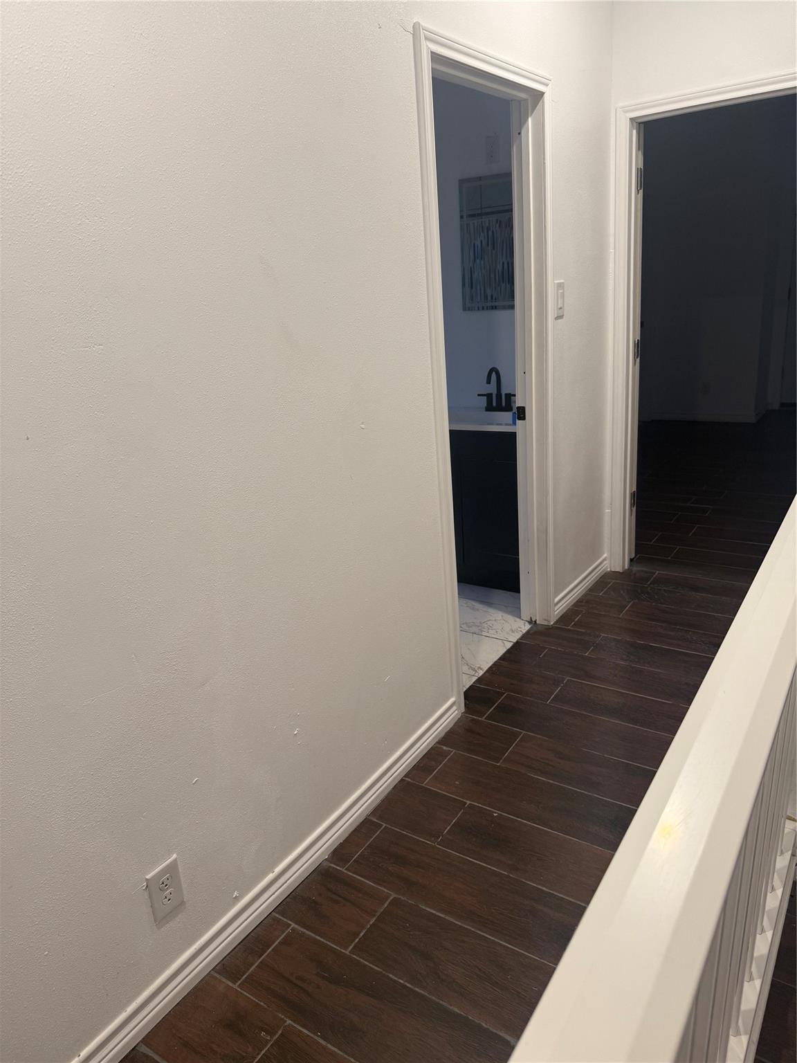 Upstairs hallway leading to bedrooms and bathroom